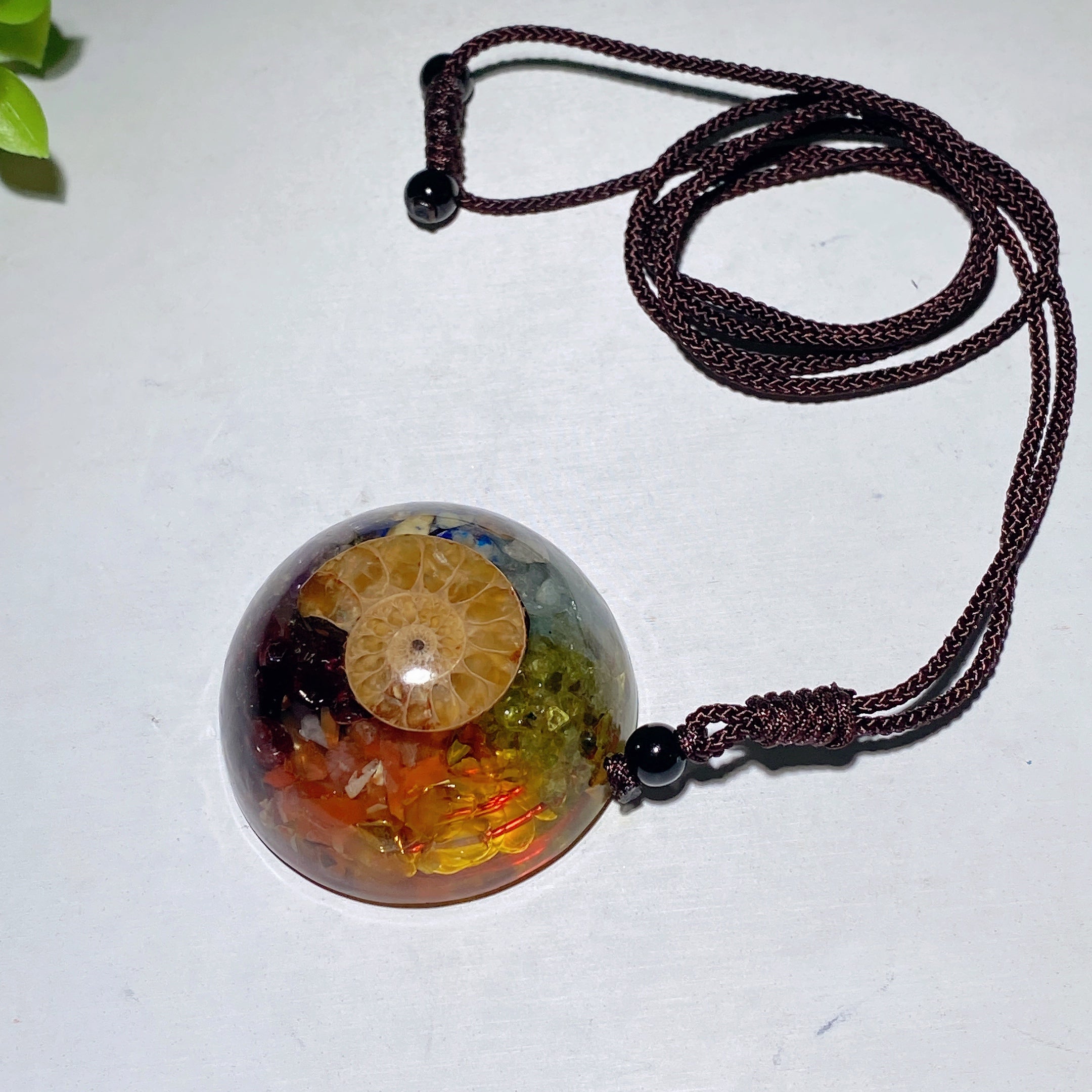 1.6-inch Resin Infused Ammonite Pendant with Amethyst Chips