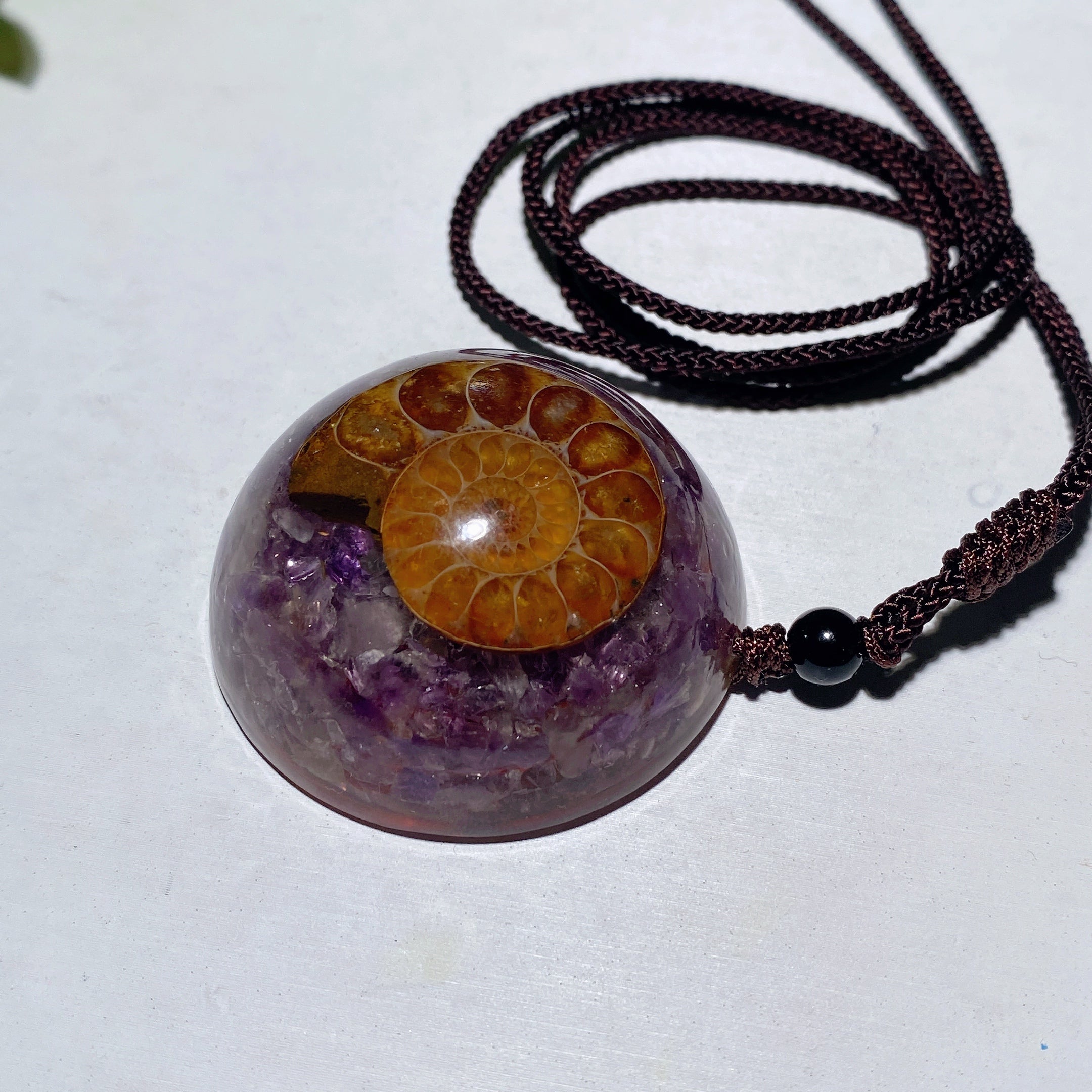 1.6-inch Resin Infused Ammonite Pendant with Amethyst Chips