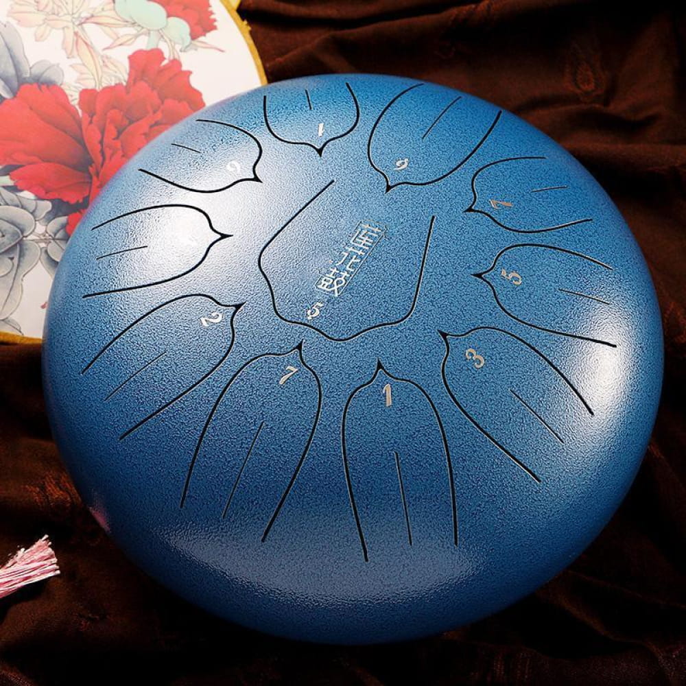 Blue steel tongue drum with petal-shaped tone markings in C key, 12-inch size