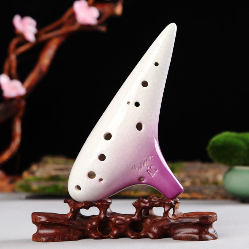 White and purple ceramic ocarina with holes on brown stand for 12 Hole Tenor Alto C