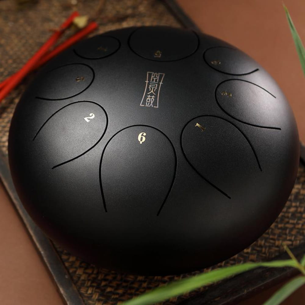 Black steel tongue drum with numbered tone zones for 12-Inch 8-Note C Key model