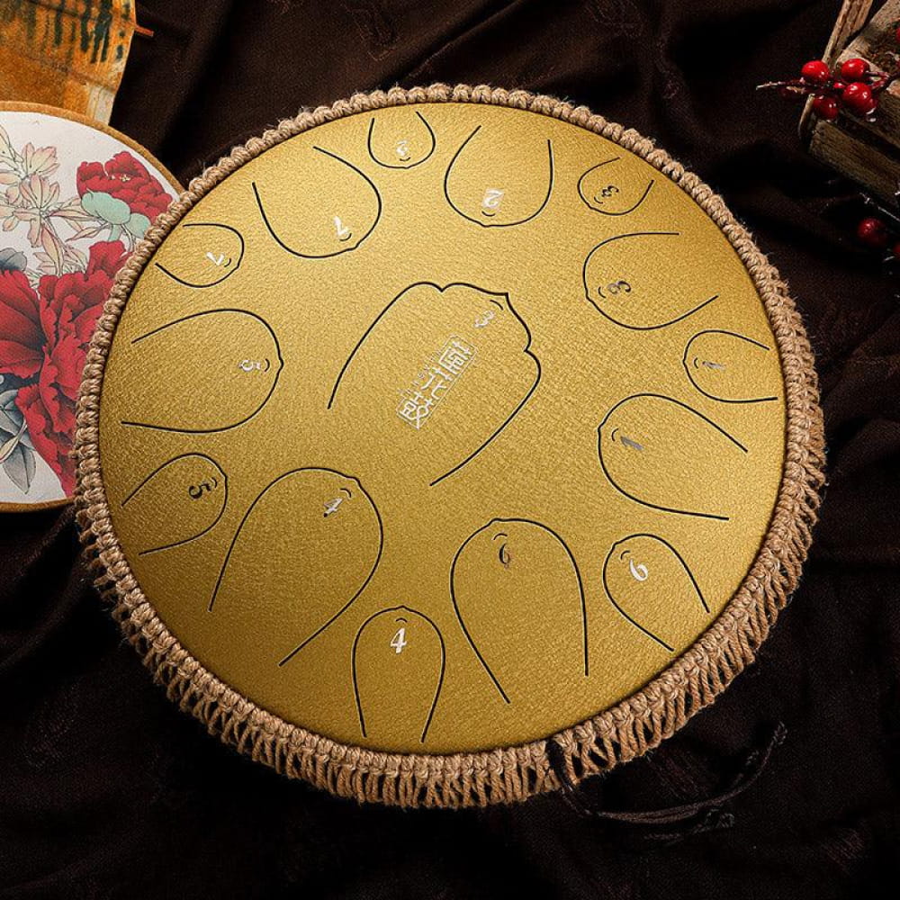 Golden steel tongue drum with patterned notes in 13-Inch Carbon Steel Tongue Drum
