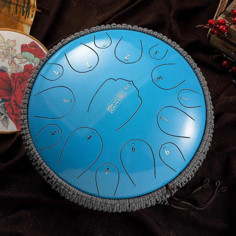 Bright blue 13-inch Carbon Steel Tongue Drum with 15 notes and decorative gray fringe
