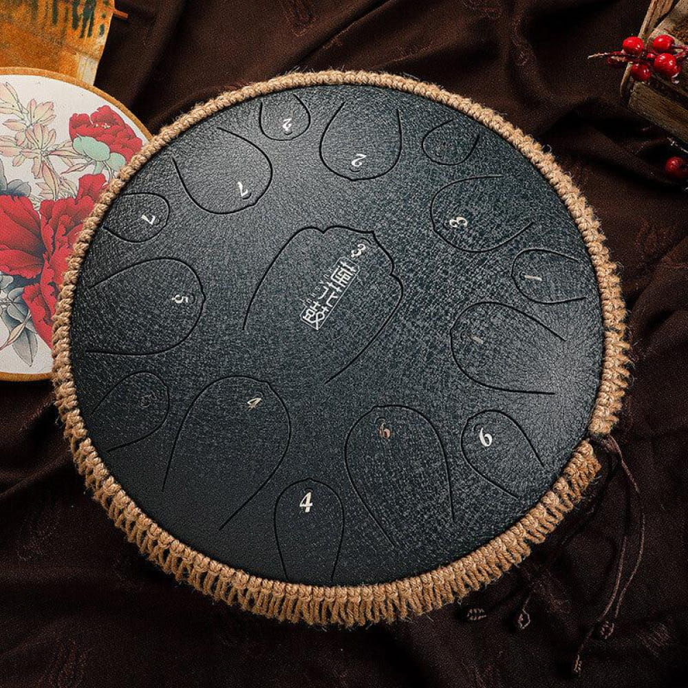 Steel tongue drum with numbered tone zones and woven rope edge, 13-inch D Key