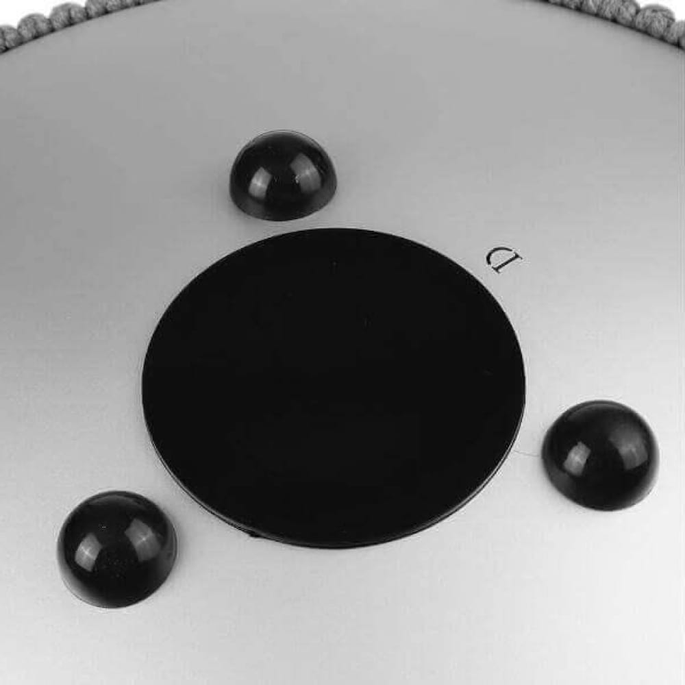 Black circular disc with three dark spheres around 13-Inch Titanium Steel Tongue Drum