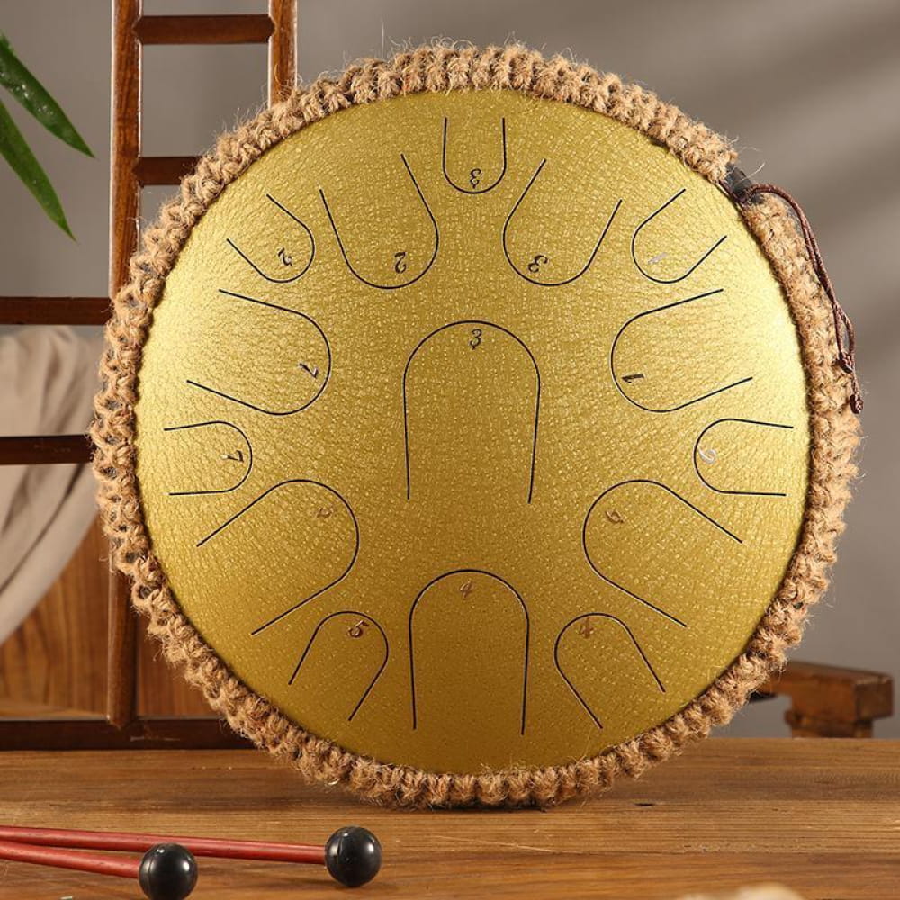 Golden 13-Inch Titanium Steel Tongue Drum with decorative braided trim and 15 notes