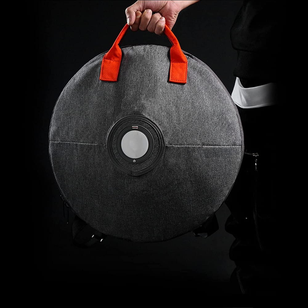 Circular black weight plate with red handles for 14 Inch 9 Note D Minor Tongue Drum