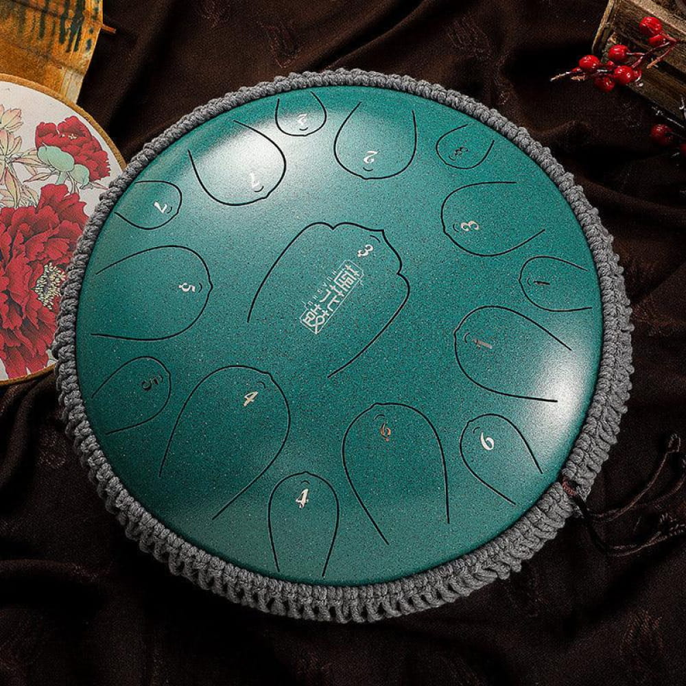 Teal steel tongue drum with numbered tone zones and gray knitted border 14-inch D key