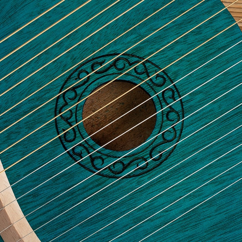 Teal acoustic guitar with decorative rosette, featured in 16 String Mahogany Lyre Harp