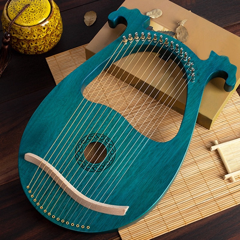 Turquoise lyre harp with decorative edges featured in 16 String Mahogany Lyre Harp Instrument