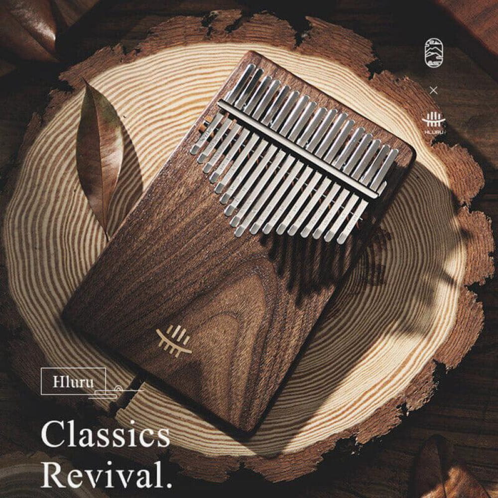 Wooden Kalimba with metal tines on rustic wood, 17 Key Black Walnut Thumb Piano