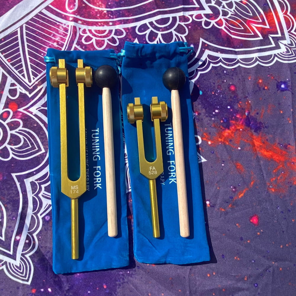 Two blue-protected tuning forks for 174 Hz and 528 Hz healing therapies