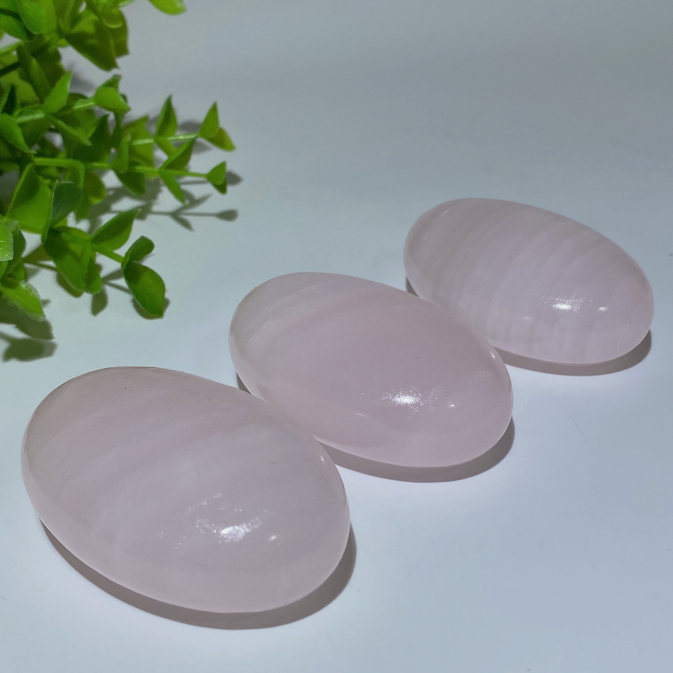 2.2-2.4in UV Reactive Pink Calcite Healing Palm Stone Trio