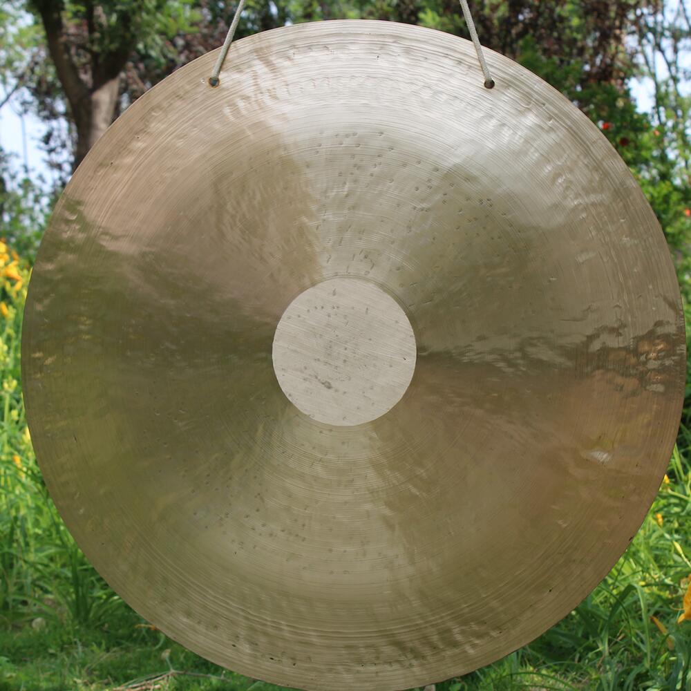 Circular metallic gong with raised center dot for sound healing in 32 Inch Wind Gong Instrument