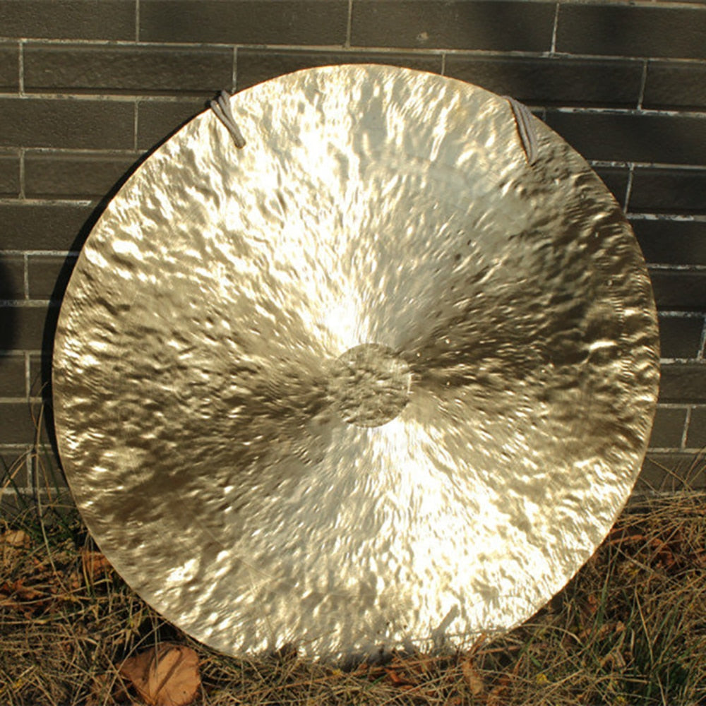 Circular metallic gong with a textured surface reflecting light, 38 Inch Chinese Wind Gong Instrument