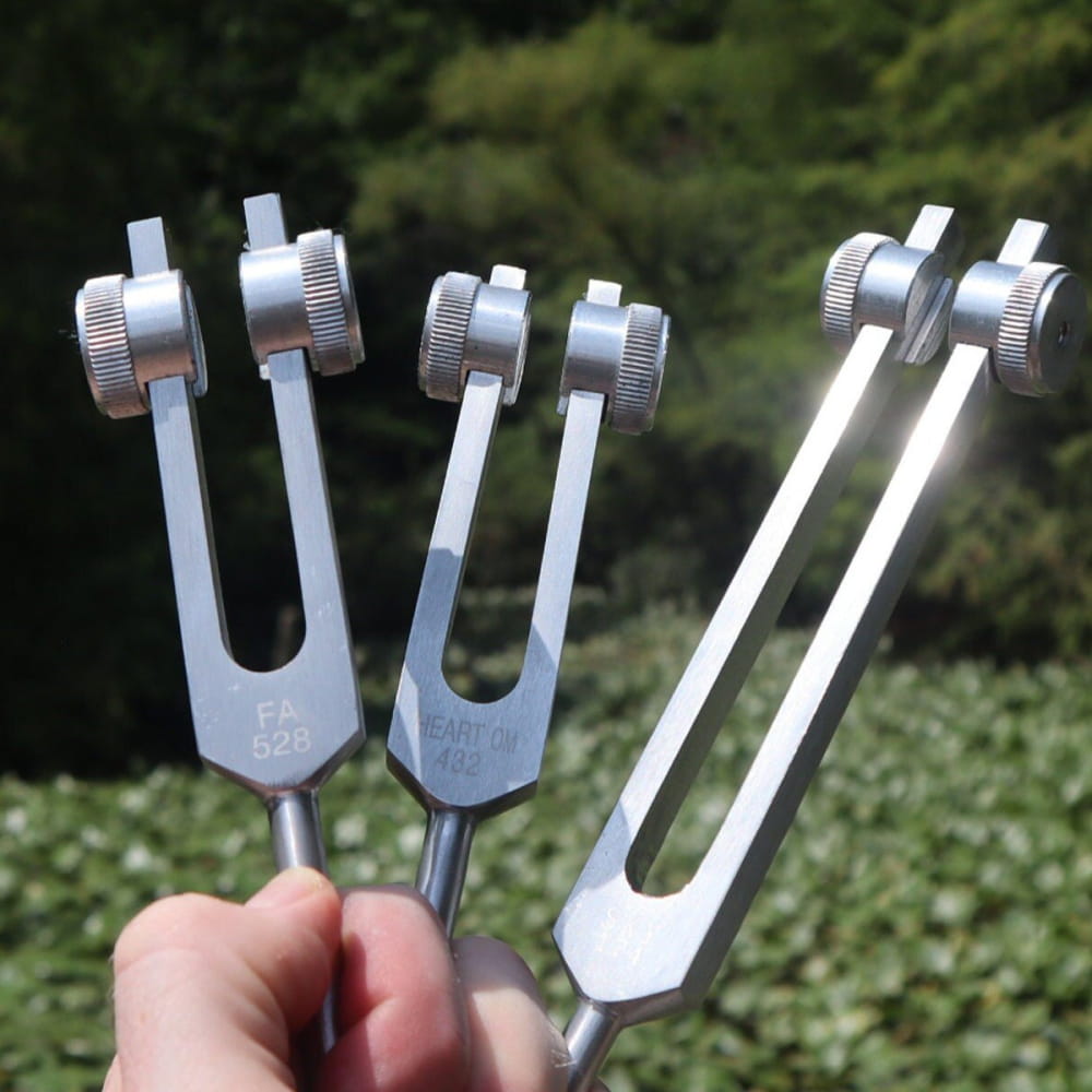 Three metal tuning forks with adjustable weights in Solfeggio Tuning Fork Set