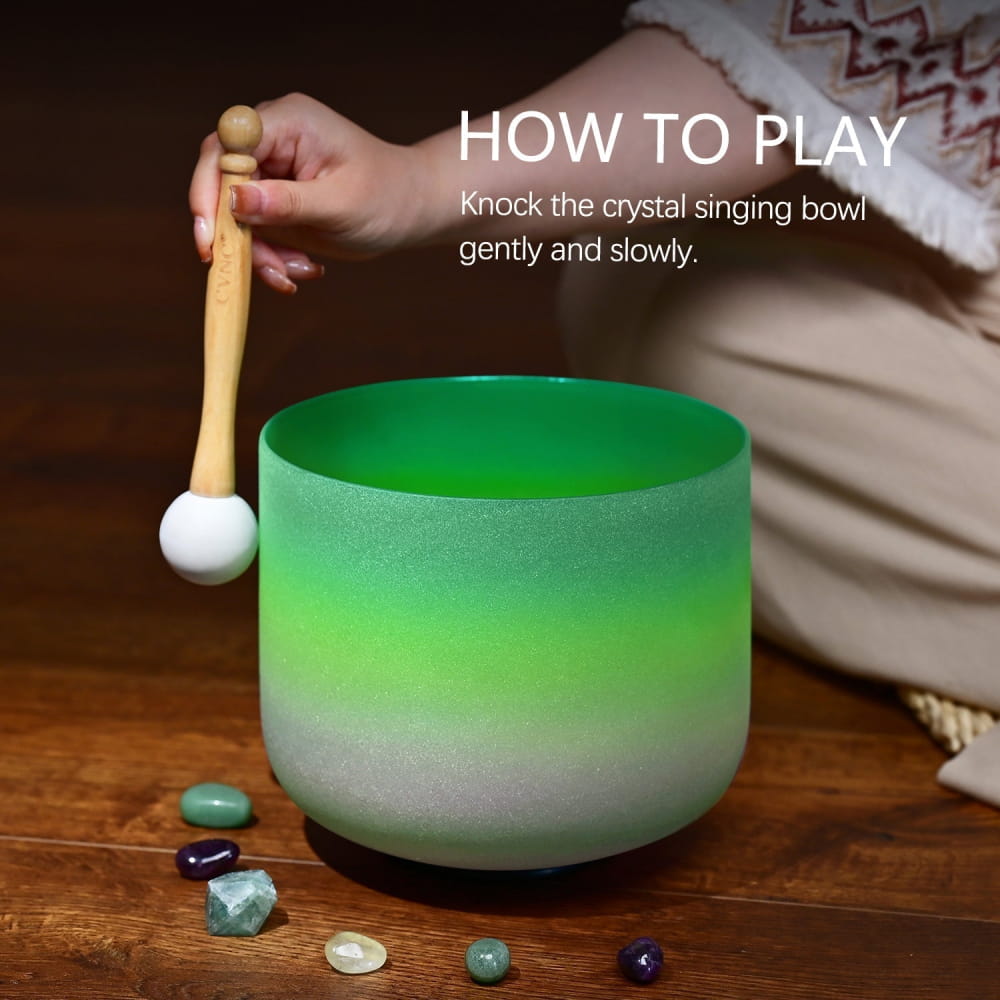 Frosted green crystal singing bowl with mallet and gemstones for 440Hz F note healing