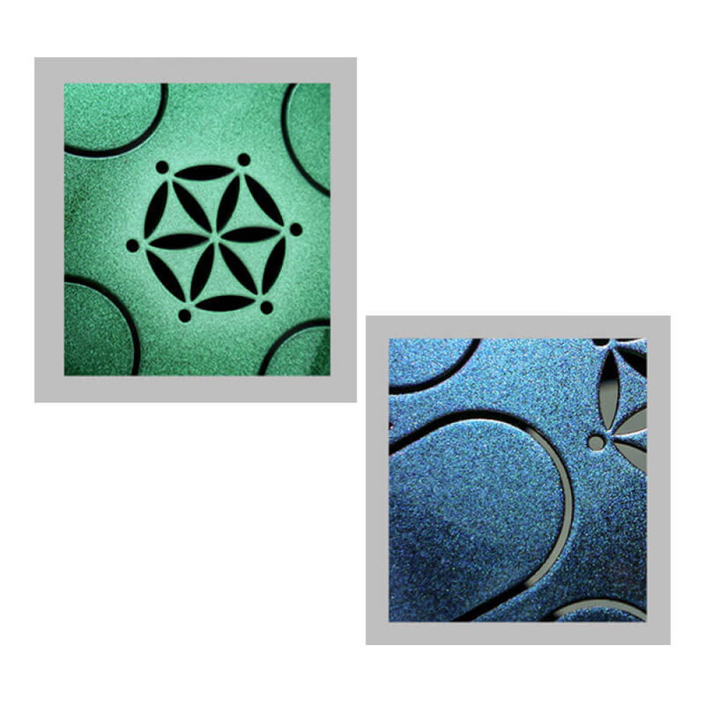 Two decorative tiles with geometric floral patterns in green and blue metallic finishes