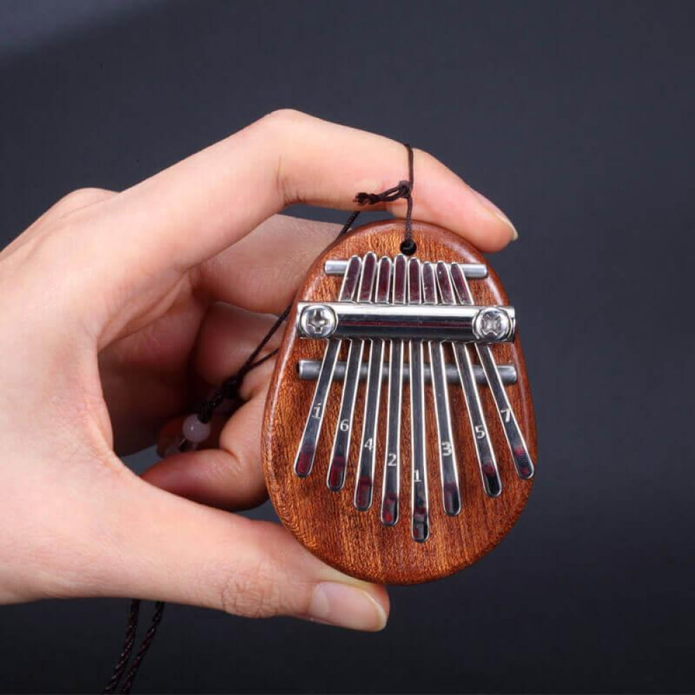 Wooden Kalimba thumb piano with metal tines, perfect for kids and adult beginners