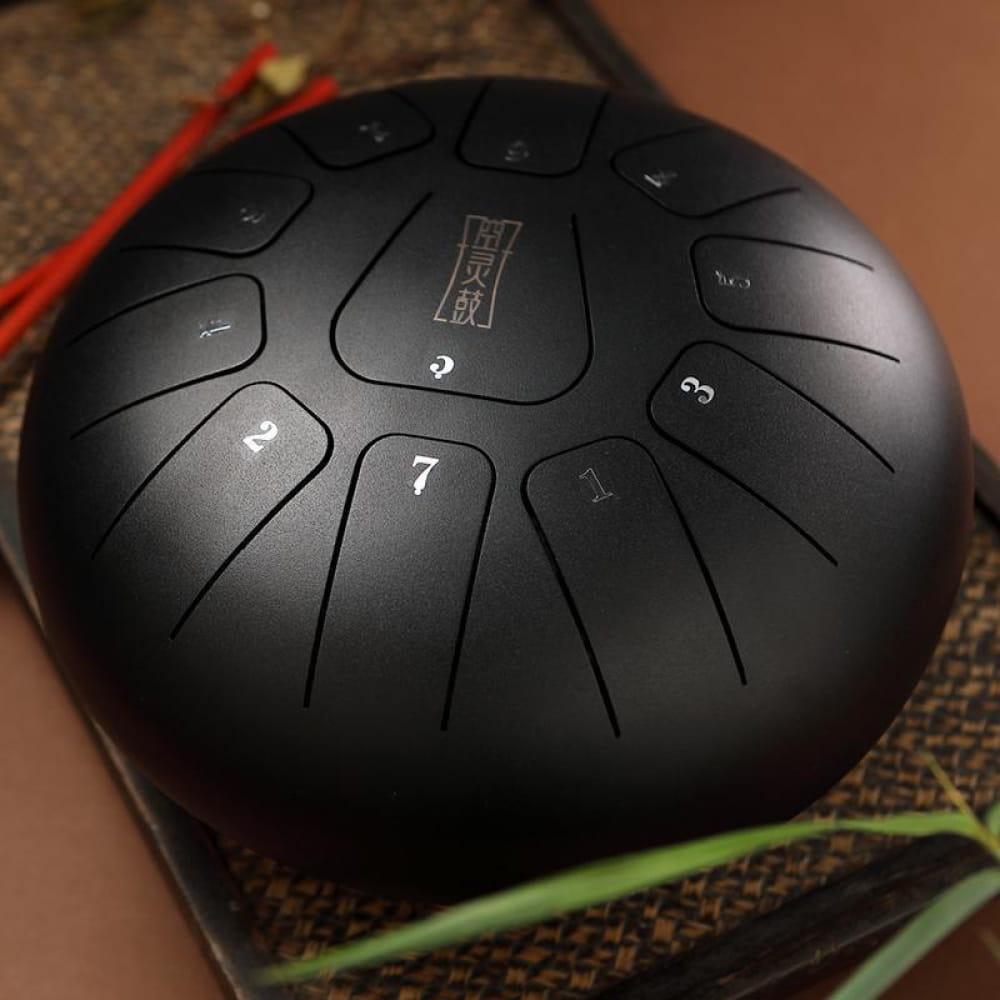 Black steel tongue drum with numbered sections, 8’’ Square, 11 Notes in F Key