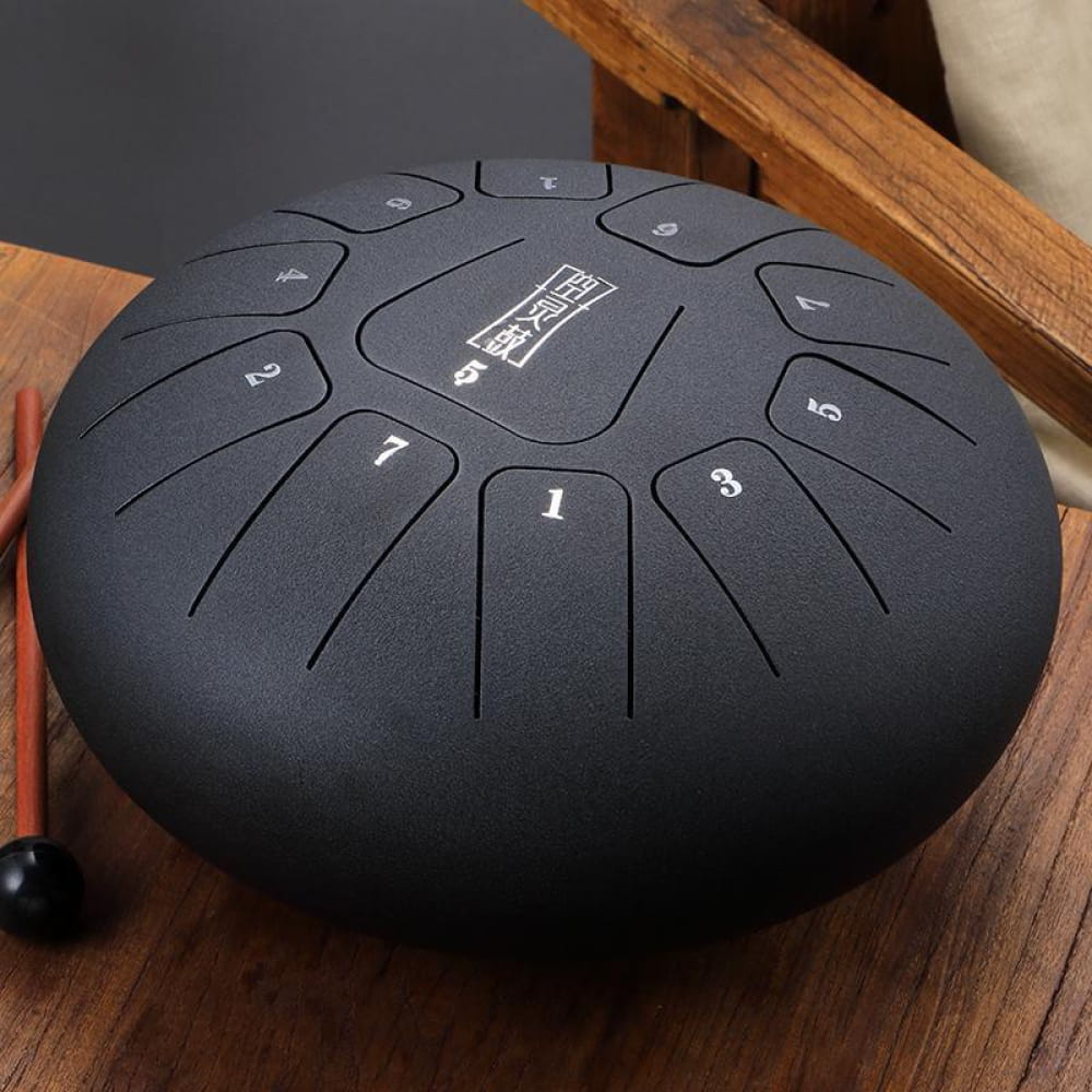 Black steel tongue drum with numbered segments in a circular pattern, 8 Inch Square
