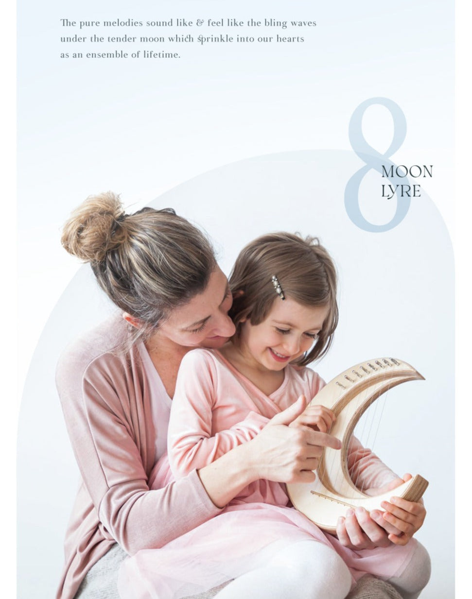 Parent and child share a tender reading moment with the 8-String Mini Lyre Harp