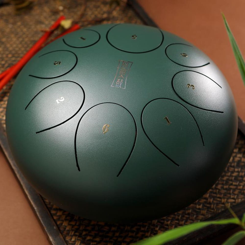 Green 8-Tone D Key Steel Tongue Drum with circular tone fields, 10-inch instrument