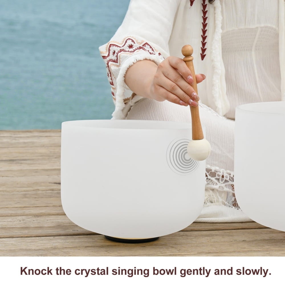 White crystal singing bowl with wooden mallet from Frosted Quartz Crystal Singing Bowl Set