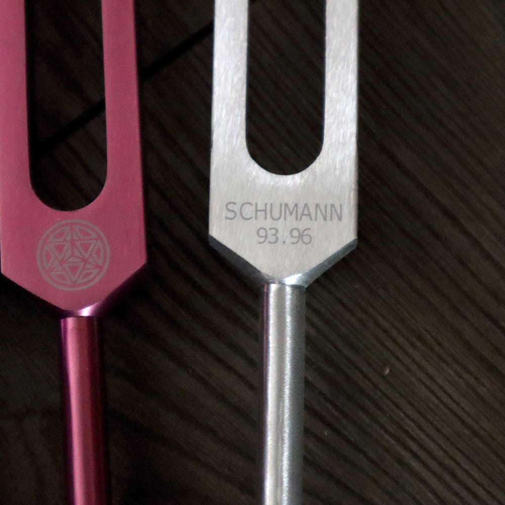 Pink and silver tuning forks engraved with Schumann 93.96 in Chakra Tuning Forks Set