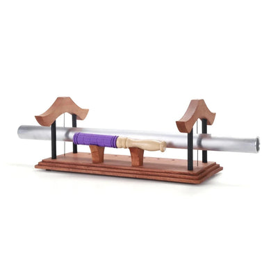 Sound healing instrument with a purple-handled mallet included.