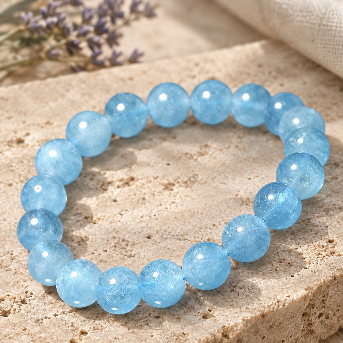 8mm Aquamarine Healing Beads Peace Bracelet, three-quarter view of the bracelet