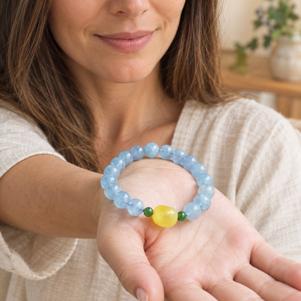Natural Aquamarine Amber Serenity Healing Bracelet 8mm, in open hand
