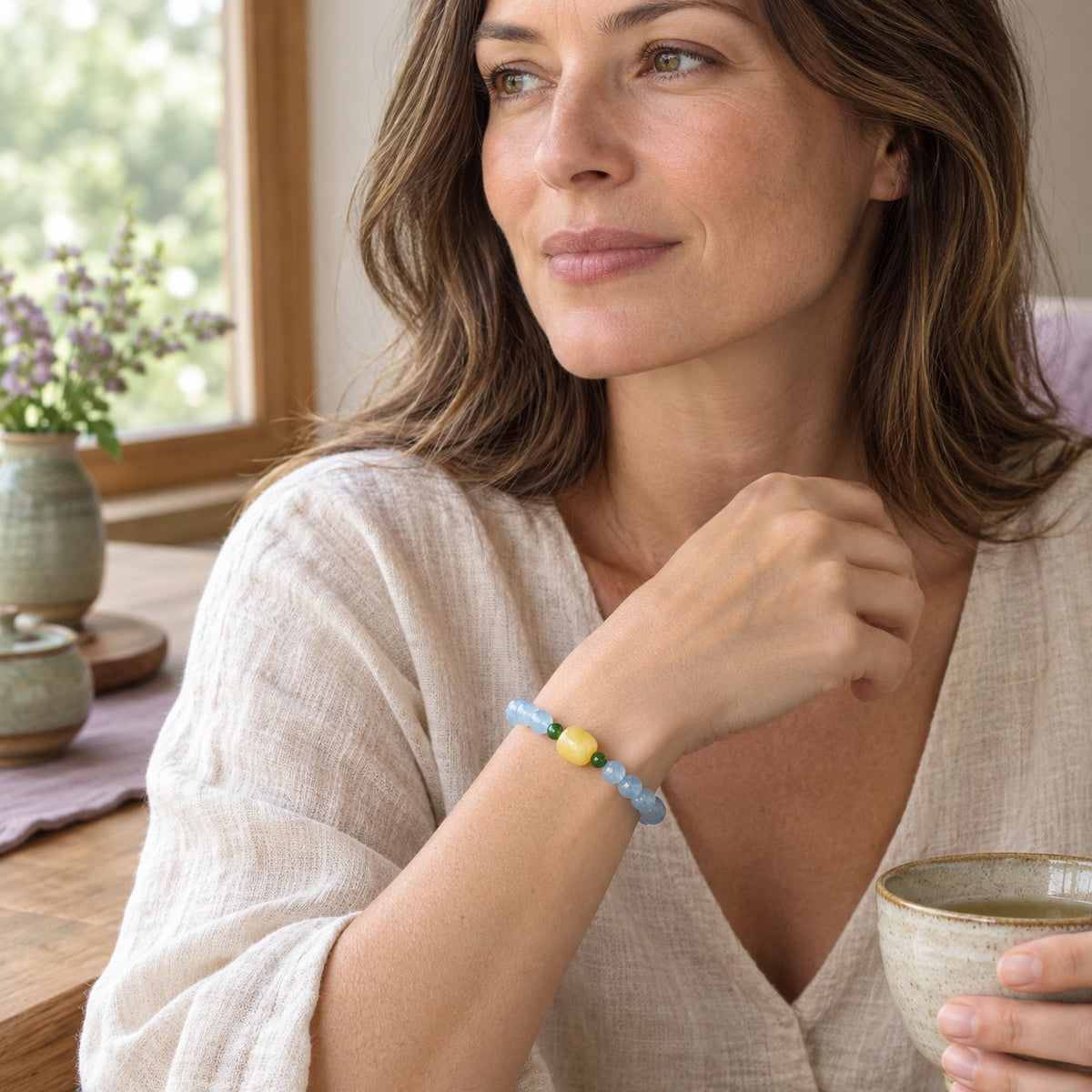 Natural Aquamarine Amber Serenity Healing Bracelet 8mm, worn by a woman in a calm everyday moment