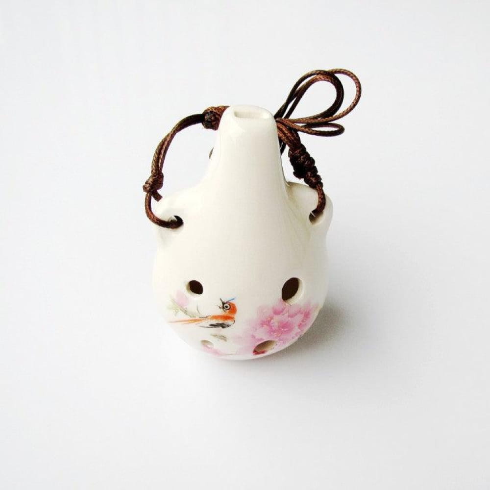White ceramic bell with floral design and cord for Beginner’s 6-Hole Alto C Ocarina Pendant