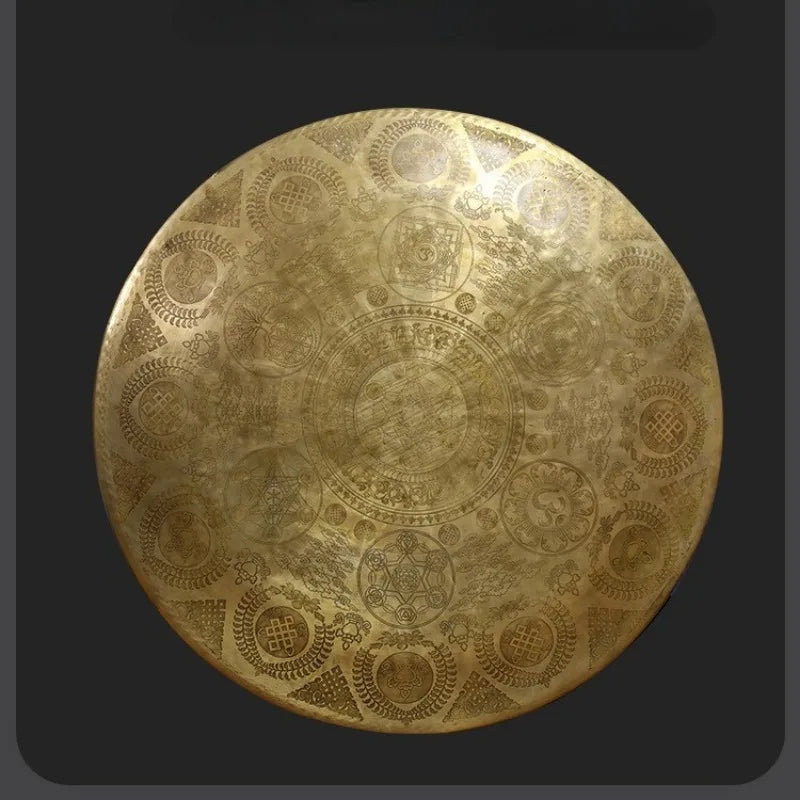 Ornate golden disc with intricate patterns on Bronze Therapy Gong for sound healing