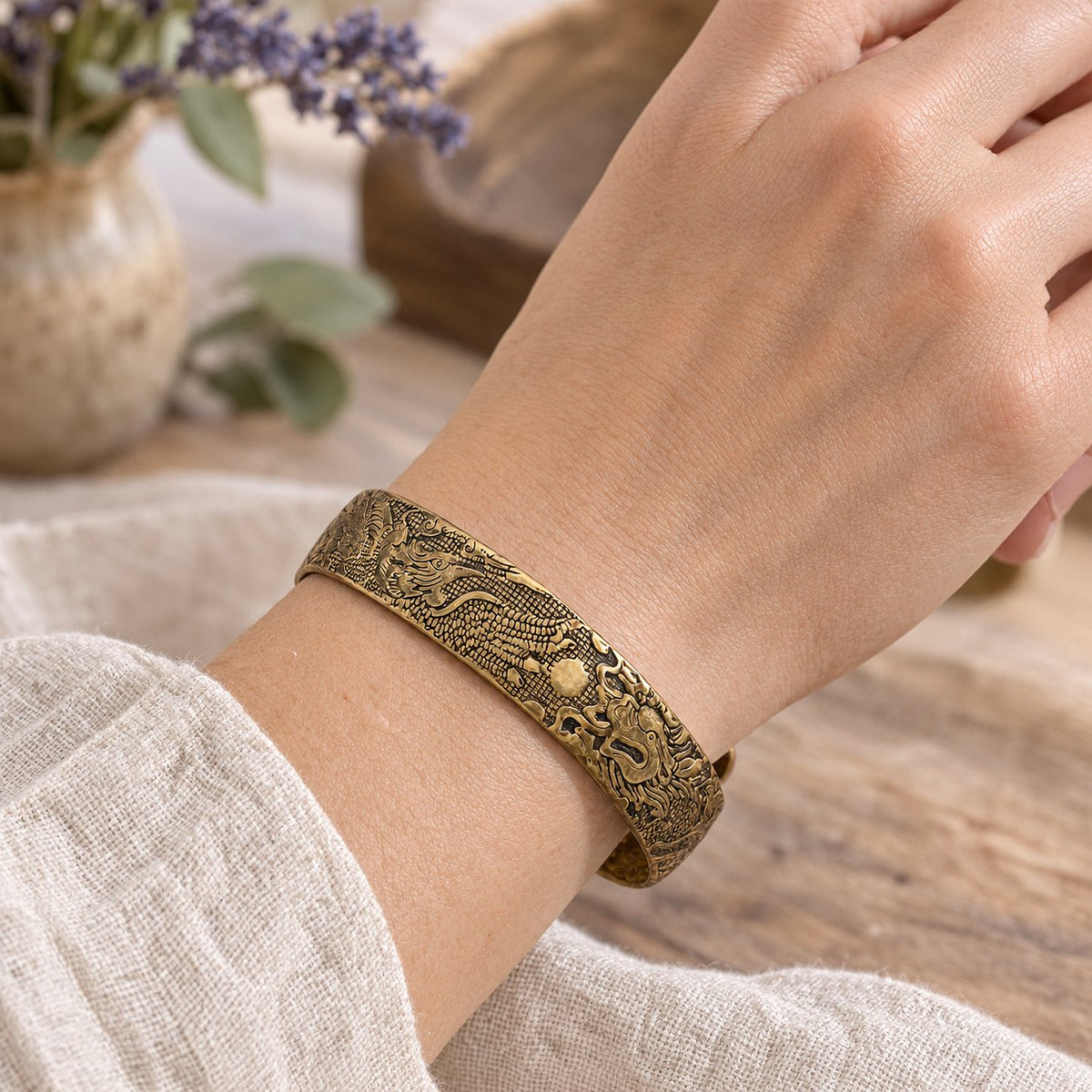 Dragon Phoenix Copper Bracelet, worn on the wrist by a woman