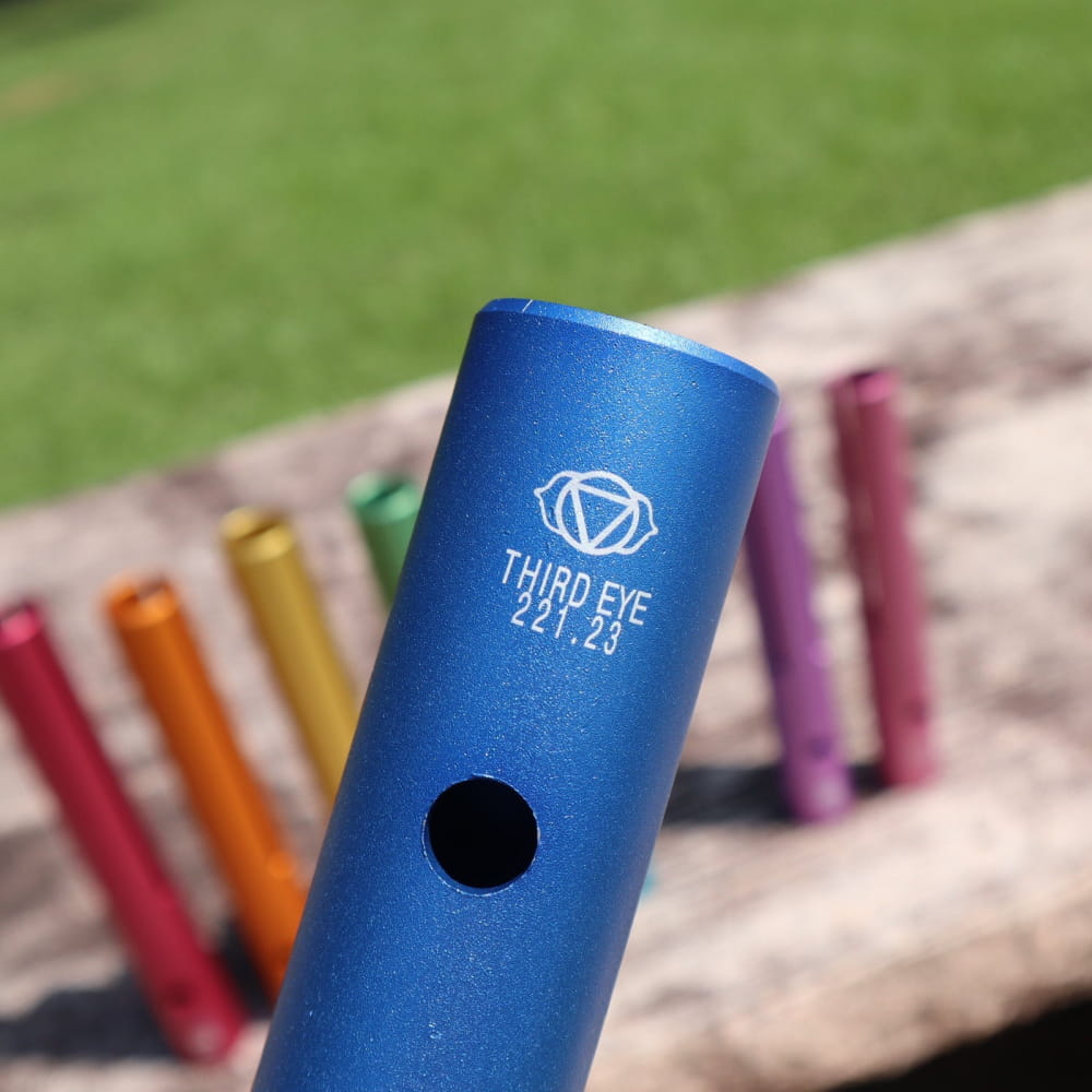 Blue metal tube with Third Eye logo for Complete Chakra Solfeggio healing frequencies