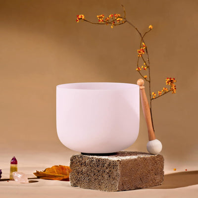 White ceramic bowl on concrete block with D Note Pink Rose Quartz Gemstone Fusion