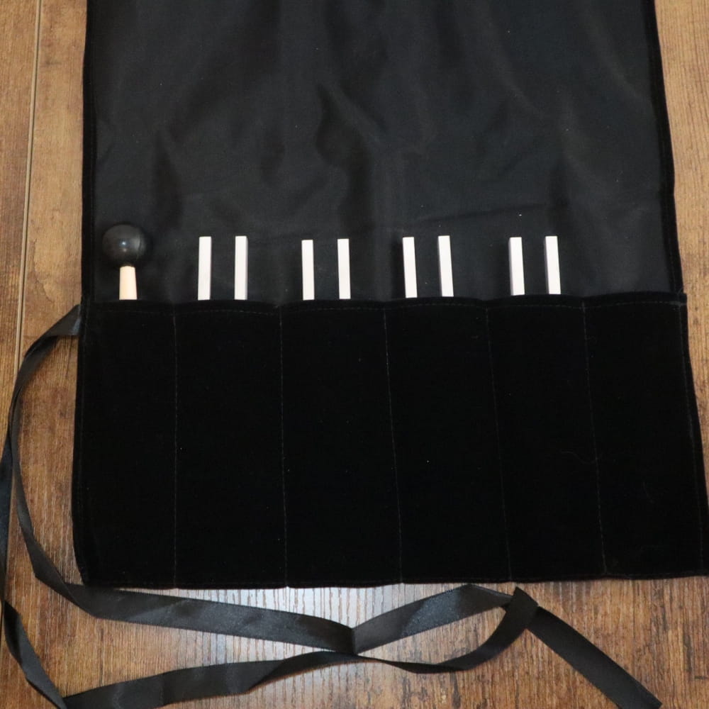 Black fabric knife roll with white slots for kitchen knives in DNA Nucleotide Tuning Fork set