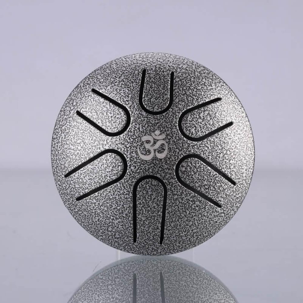 Mini Titanium Steel Tongue Drum in silver with Om symbol and circular slits design
