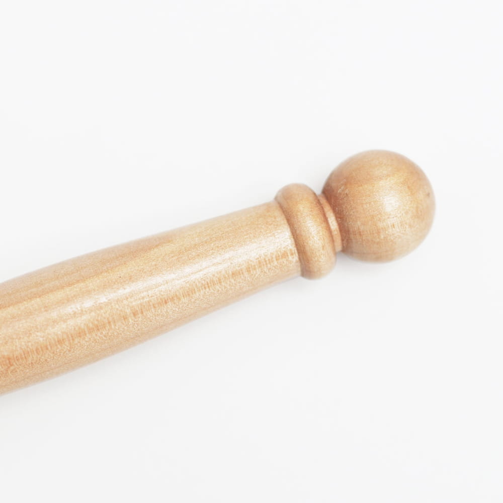 Wooden curtain rod finial with a ball-shaped end for enhancing decor and functionality