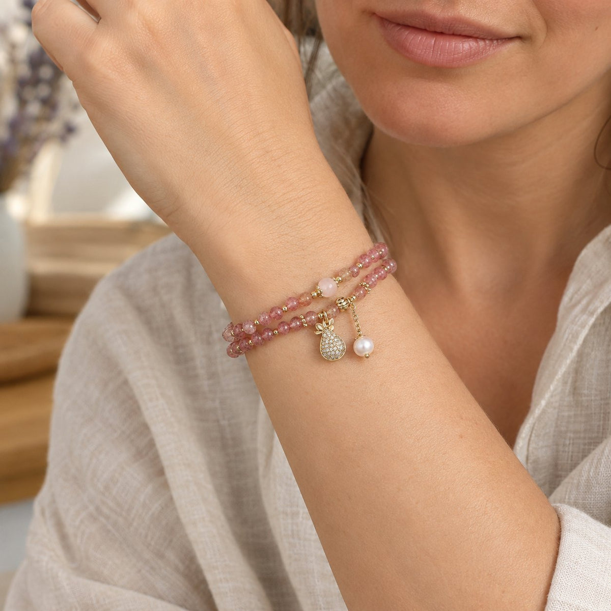 Double Wrap Strawberry Quartz Love Healing Bracelet, worn on the wrist by a woman