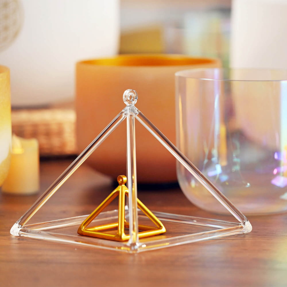 Clear and gold geometric pyramid structure of Triangle Crystal Singing Pyramid