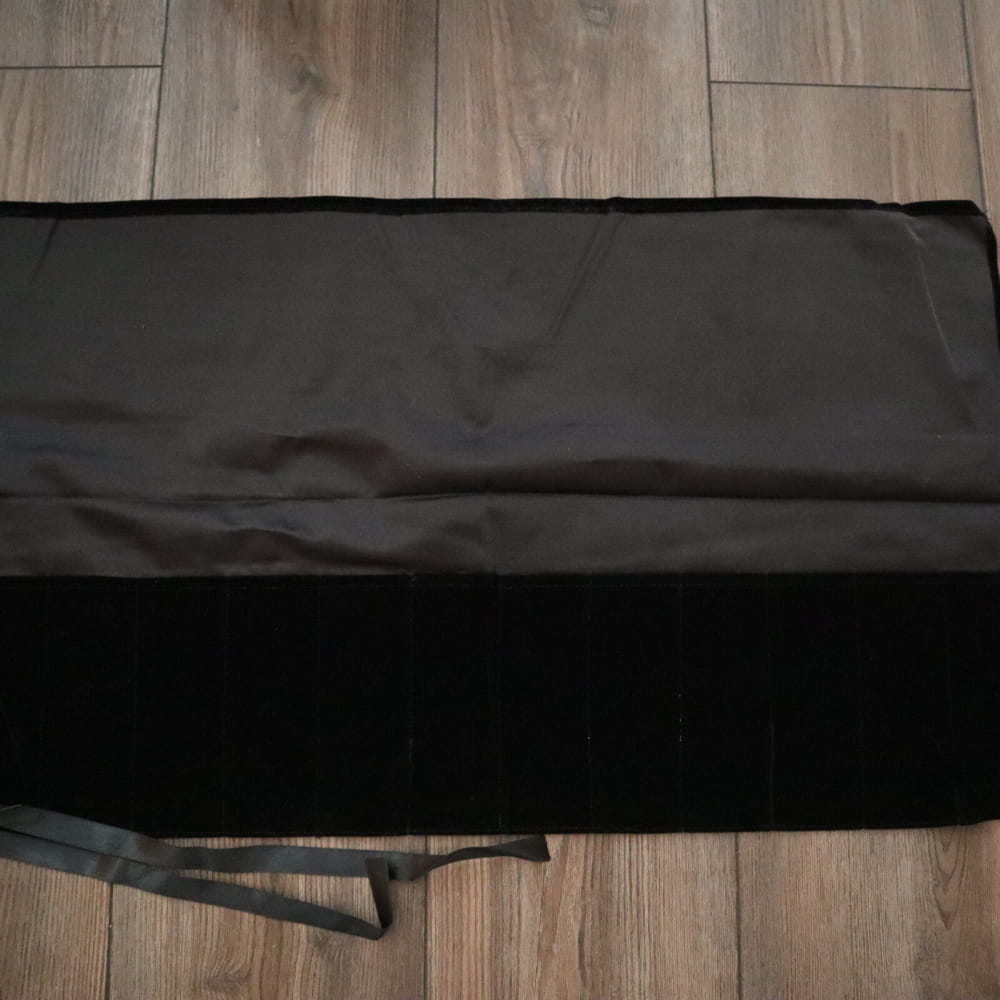 Black fabric laid flat for 10/12 inch Tuning Fork Carry Bag design showcase