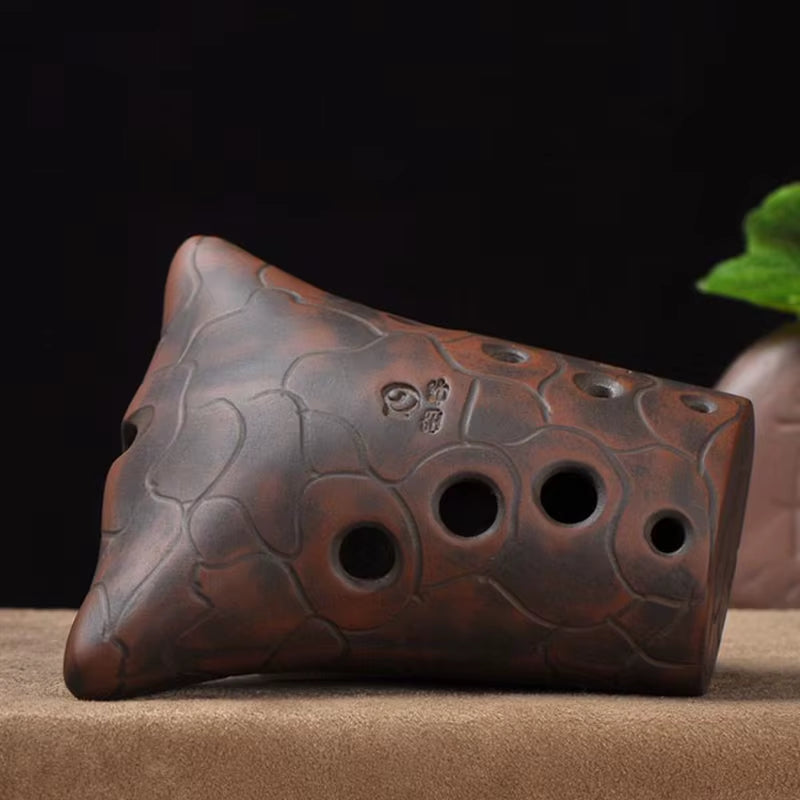 Clay ocarina with carved patterns and three finger holes for 10-Hole Double Cavity Chinese Xun