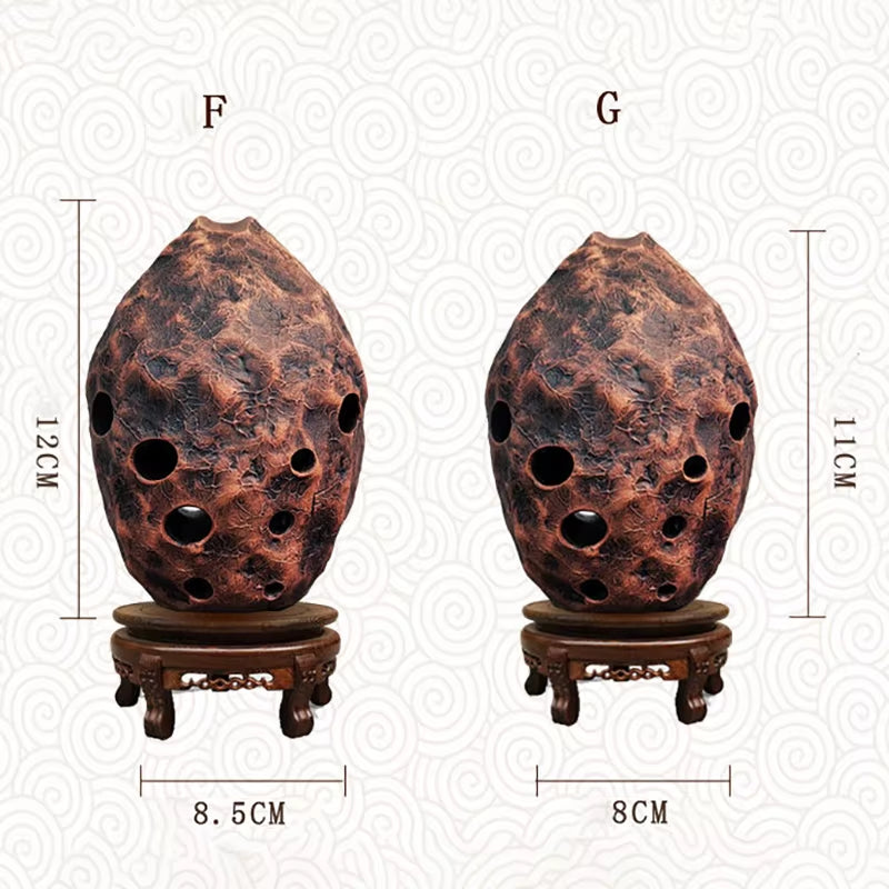 Textured ceramic ocarina with finger holes on a wooden stand for 10-Hole Pottery Xun