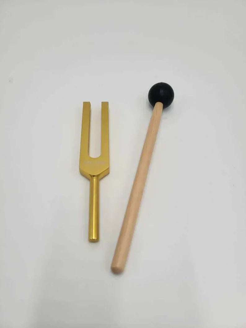 Golden tuning fork with wooden mallet for 1111 Hz Sonic Sage Healing