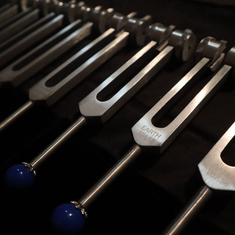 Tuning forks with blue ball ends in 11pc Planetary Tuning Fork Set for sound healing