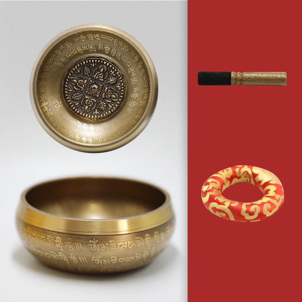 Brass Tibetan singing bowl with etched designs for meditation and sound therapy