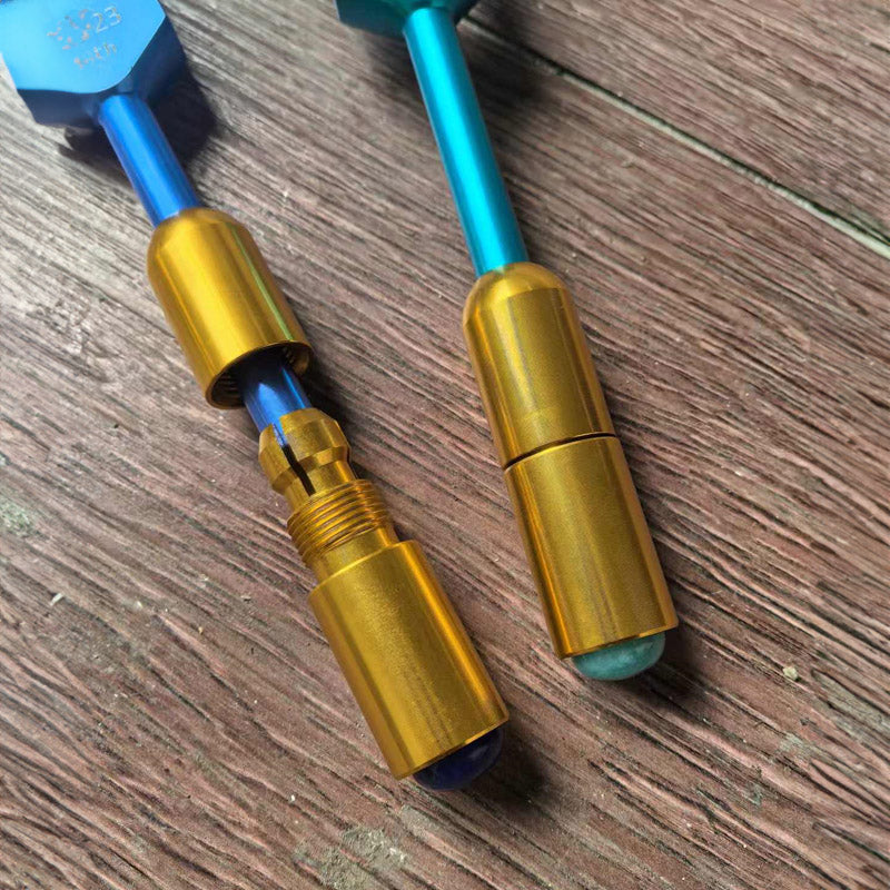 Two gold and blue metal vape cartridges in 136.10 Hz Weighted Tuning Fork display